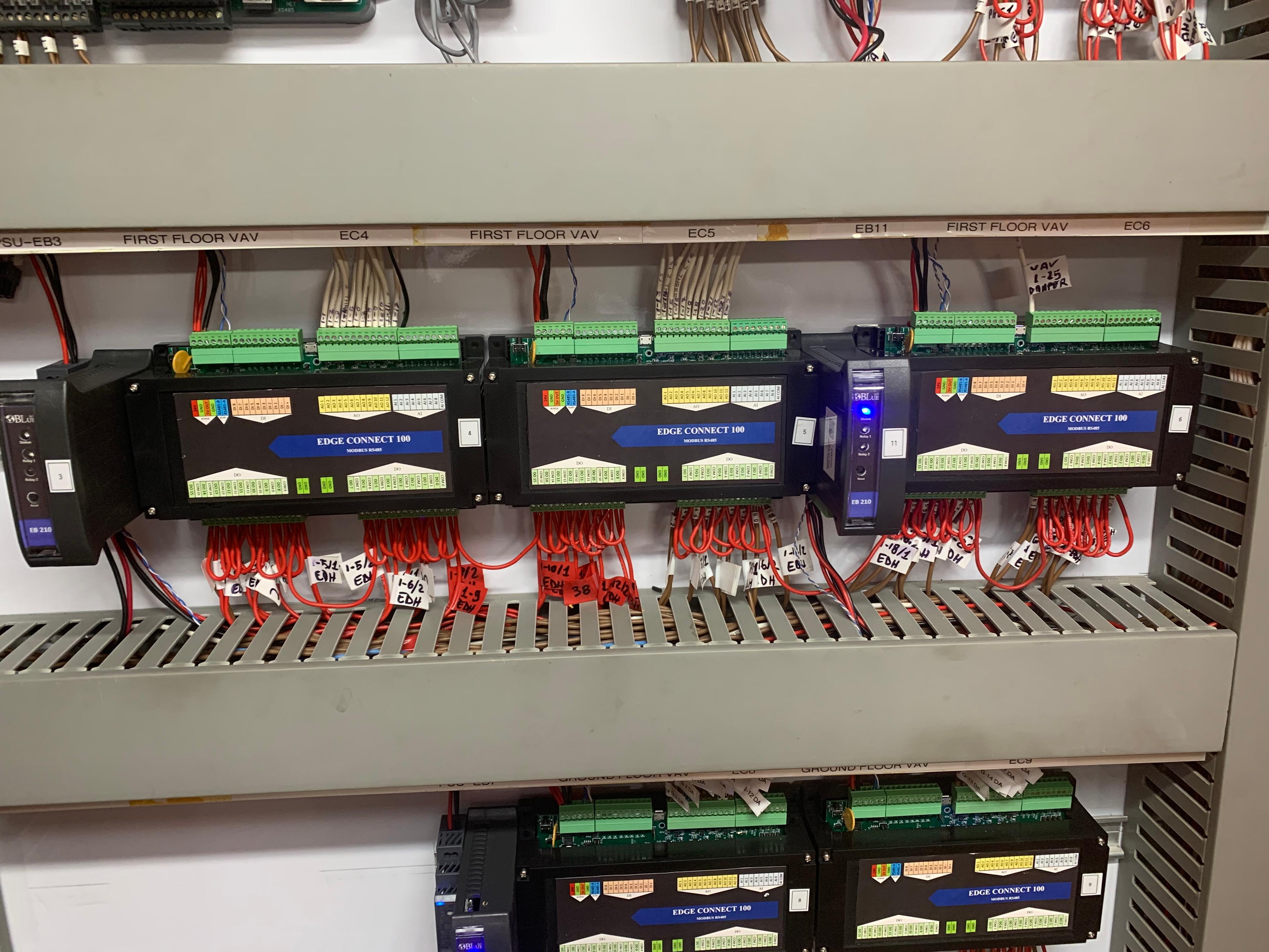 A technician working on practical smart building controls and infrastructure